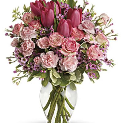 It's beauty-full! Bursting with tantalizing tulips and radiant roses, this delightful pink arrangement brings spring joy to that special someone.
Includes pink roses, tulips, carnations and waxflower, accented with fresh pitta negra and variegated pittosporum.
Delivered in a lovely glass vase.