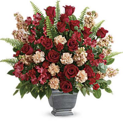 <div class="m-pdp-tabs-description">
<div id="mark-1" class="m-pdp-tabs-marketing-description">A bold expression of your deepest condolences, this elegant mix of red and peach blooms in a large antiqued pot brings strength and comfort.</div>
</div>
<p id="arrngDescp">Red roses, red alstroemeria, peach carnations, miniature red carnations, and peach stock are arranged with spiral eucalyptus, seeded eucalyptus, sword fern, and lemon leaf.</p>