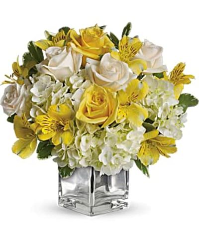 <div id="mark-3" class="m-pdp-tabs-marketing-description">Even if she's already in a great mood, this cheerfully charming bouquet will boost her spirits to the sky. Yellow roses, crème roses and other favorites in a sleek silver cube vase - irresistible!</div>
<div id="desc-3">
<ul>
 	<li>The bright bouquet includes white hydrangea, light yellow roses, crème roses and yellow alstroemeria accented with fresh greenery.</li>
 	<li>Delivered in a contemporary glass cube with a mirrored silver finish.</li>
</ul>
</div>