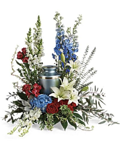 <div class="m-pdp-tabs-description">
<div id="mark-1" class="m-pdp-tabs-marketing-description">Proud and patriotic, this boldly designed red, white and blue bouquet displays the cremation urn with honor.</div>
</div>
<p id="arrngDescp">This patriotic tribute includes blue hydrangea, white dendrobium orchids, red roses, white asiatic lilies, red alstroemeria, red carnations, blue delphinium, white snapdragons, dusty miller, myrtle, huckleberry, variegated ivy, curly willow, aralia leaves, parvifolia eucalyptus, spiral eucalyptus, and lemon leaf.</p>
<p>Arrangement does not include urn.</p>