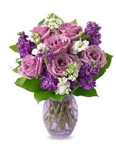 <p>Lovely lavender roses, lavender stock, and pink stock are accented with a variety of lush greens in this amazing floral arrangement. Presented in a glass vase, the bouquet is a wonderful gift to help celebrate an anniversary, a birthday, or just because.</p>