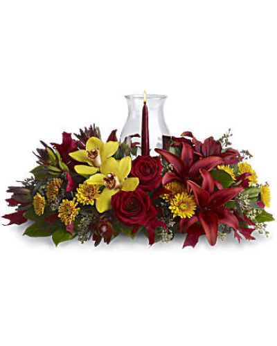 <div id="mark-3" class="m-pdp-tabs-marketing-description">Give thanks by sending this fall flower centerpiece. A chic, exotic spin on the traditional Thanksgiving centerpiece, it features orchids, roses, lilies and leucadendron in rich fall colors below a glowing taper candle, surrounded by a glass hurricane.</div>
<p>&nbsp;</p>
<div id="desc-3">
<ul>
<li>Yellow cymbidium orchids, red roses, burgundy asiatic lilies, bronze cushion mums, red leucadendron, seeded eucalyptus and salal are accented with red oak leaves.</li>
<li>A pomegranate taper candle inside a classic glass hurricane adds a warm glow to the room.</li>
</ul>
</div>