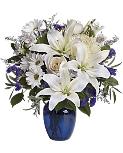 <div class="m-pdp-tabs-description">
<div id="mark-1" class="m-pdp-tabs-marketing-description">In this arrangement, the serenity of the color blue along with the purity of intention symbolized by white will express your feelings wonderfully.</div>
</div>
<p id="arrngDescp">Beautiful blooms such as blue hydrangea, crème roses, white lilies and alstroemeria along with yellow and white chrysanthemums, eucalyptus, limonium and more are beautifully arranged in a dazzling blue vase.</p>