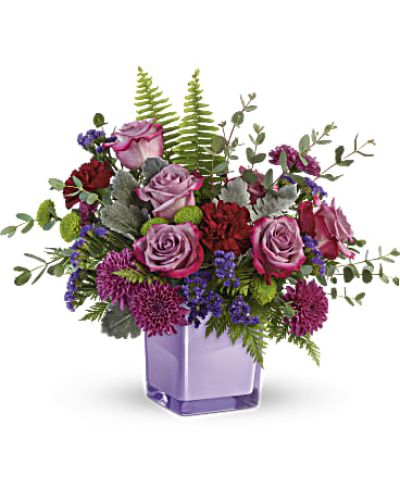 <div id="mark-3" class="m-pdp-tabs-marketing-description">A serene style statement in lush lavender roses and fresh maroon blooms, this rich bouquet in an amethyst-colored cube is a beautiful surprise for any occasion!</div>
&nbsp;
<div id="desc-3">
<ul>
 	<li>
<blockquote>Lavender roses, maroon carnations, purple cushion spray chrysanthemums, green button spray chrysanthemums, and purple sinuata statice are accented with sword fern, leatherleaf fern, dusty miller, and parvifolia eucalyptus.</blockquote>
</li>
</ul>
</div>