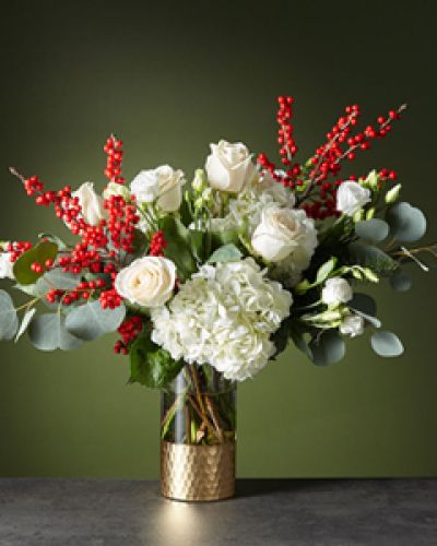 <p>String boughs of holly throughout your home with our Winter Forest Bouquet. Anticipate dynamic movement with a diverse gathering of white roses, hydrangea, lisianthus, crimson ilex berries and wooded greenery for a dazzling holiday.</p>