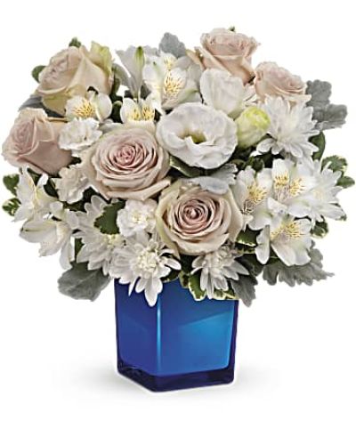 <div id="mark-3" class="m-pdp-tabs-marketing-description">Bursting with gorgeous roses and blooms, this cobalt glass cube vase is a gorgeous gift that can also serve as a beautiful candleholder!</div>
<p>&nbsp;</p>
<div id="desc-3">This splendid bouquet features crème roses, white cushion spray chrysanthemums, white lisianthus, white alstroemeria, miniature white carnations, dusty miller and variegated pittosporum.</div>