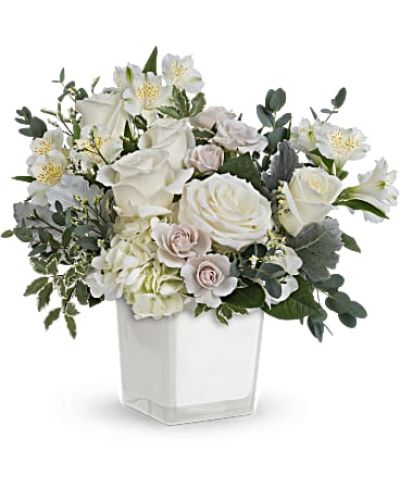 &nbsp;
<div id="mark-3" class="m-pdp-tabs-marketing-description">As serene as soft white clouds floating in a crisp blue sky, this elegant white rose bouquet in a simple glass cube brings peace and beauty to any occasion.</div>
&nbsp;
<div id="desc-3">This peaceful arrangement includes white hydrangea, white roses, white spray roses, white alstroemeria, dusty miller, white limonium, parvifolia eucalyptus and pitta Negra.</div>