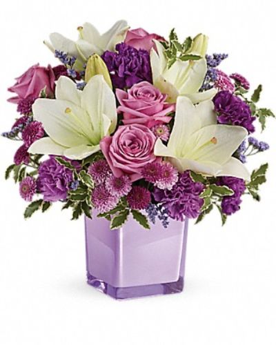 <div class="m-pdp-tabs-description">
<div id="mark-3" class="m-pdp-tabs-marketing-description">These luxurious lavender roses and crisp white lilies are poised to please! Perfectly presented in a stylish cube vase, it's an any-occasion surprise they'll never forget!</div>
</div>
<p id="arrngDescp">Lavender roses, white asiatic lilies, purple carnations, lavender carnations, purple button spray chrysanthemums and lavender button spray chrysanthemums are arranged with lavender limonium and pitta negra. Delivered in a glass cube.</p>