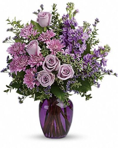 <div class="m-pdp-tabs-description">
<div id="mark-1" class="m-pdp-tabs-marketing-description">Capture the magic of togetherness with this bountiful bouquet of enchanting lavender roses. Artfully arranged in a glass vase, its twilight hues are sure to brighten anyone's day!</div>
</div>
<p id="arrngDescp">This dramatic arrangement includes lavender roses, lavender stock, lavender cushion spray chrysanthemums, lavender limonium, oregonia and lemon leaf. Delivered in a purple glass vase.</p>