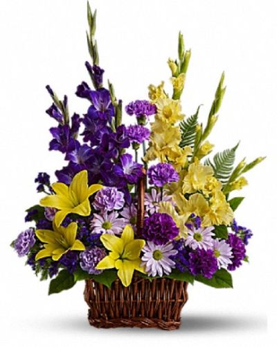 <div class="m-pdp-tabs-description">
<div id="mark-1" class="m-pdp-tabs-marketing-description">Honor rich remembrances of one dearly missed with a vivid mix of blooms that offer strength and comfort alike during a time of sorrow.</div>
</div>
<p id="arrngDescp">Beautiful fresh flowers such as yellow asiatic lilies and gladioli contrast with purple carnations, statice and gladioli, plus lavender carnations and chrysanthemums in a rectangular basket with handle.</p>