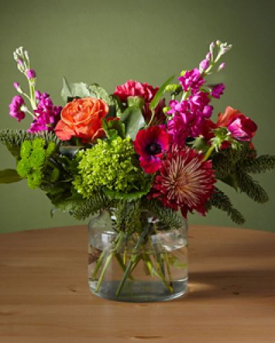 <p>Our Bells & Whistles Bouquet is designed for the playful guest looking for a colorful twist on holiday classics. The electric pink anemone and green hydrangeas add a youthful pep to traditions and show there's more than one way to celebrate.</p>